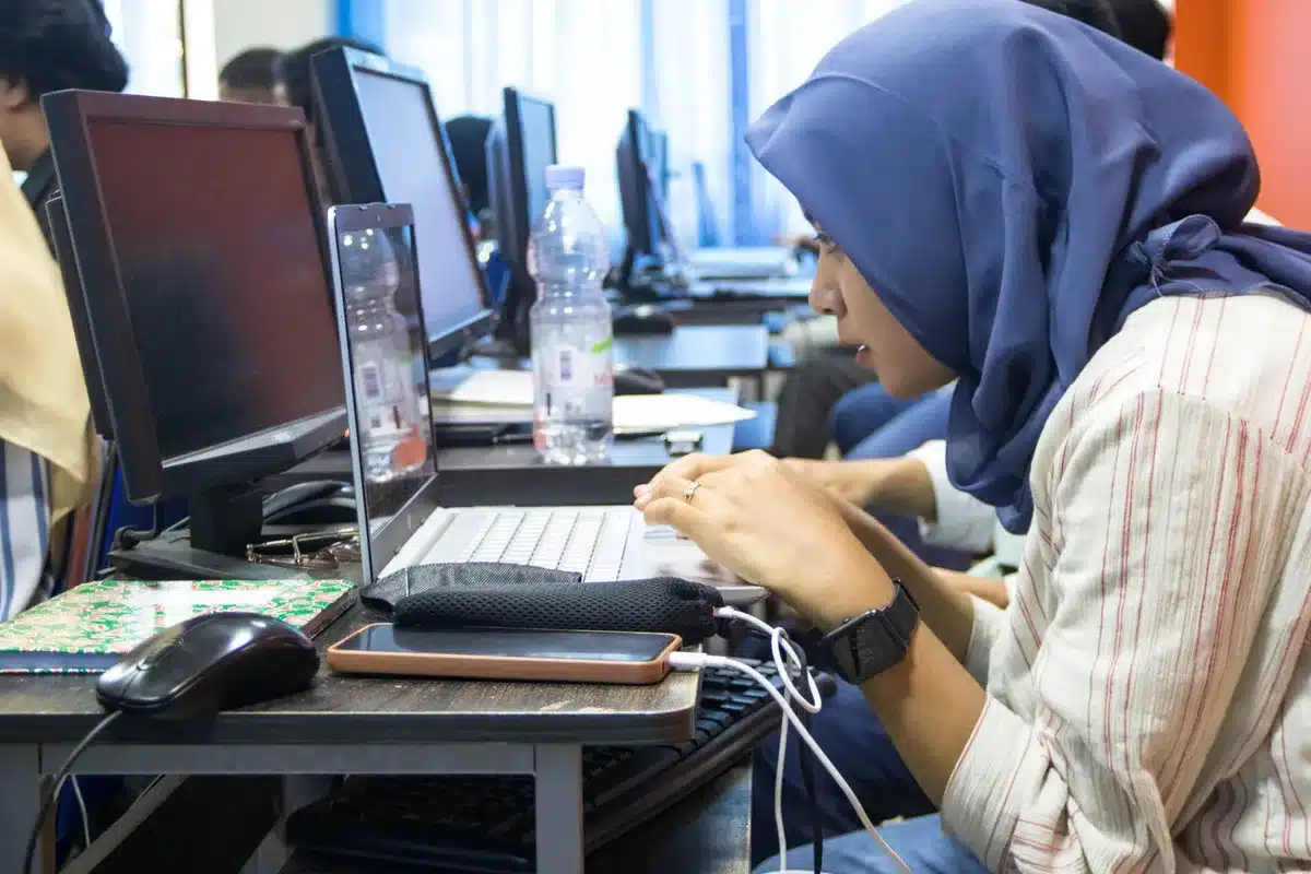 Employee participating in skills training on a computer or in a classroom setting