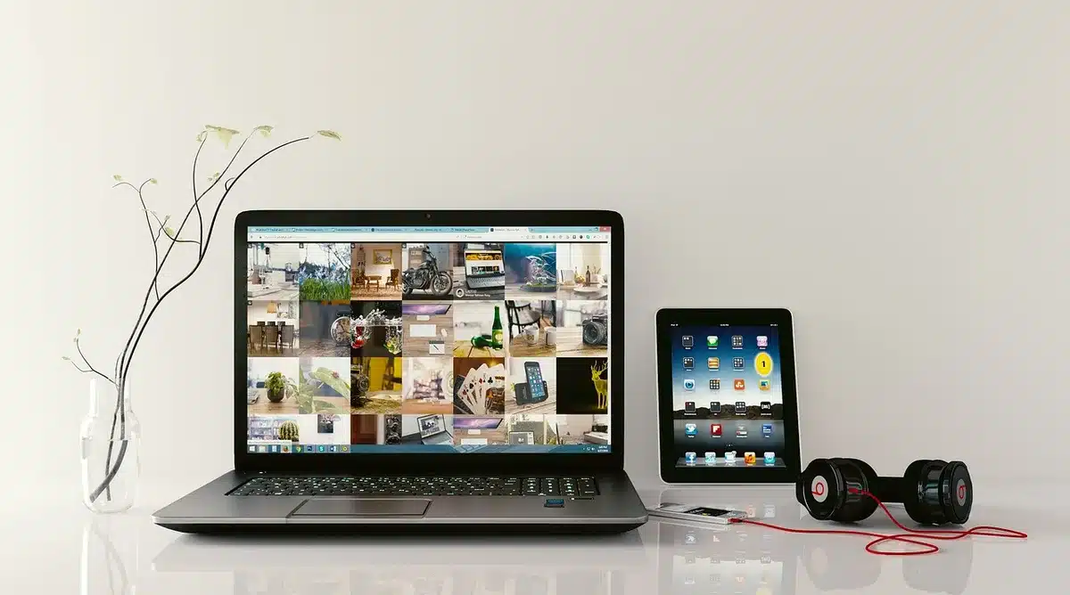 Hands interacting with AI-powered devices and smartphone interface in a modern workspace