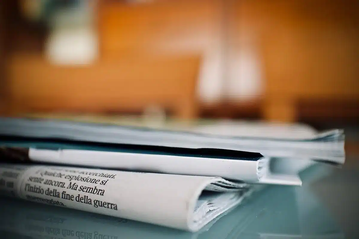 Editor scanning Google News and Discover feeds on a laptop