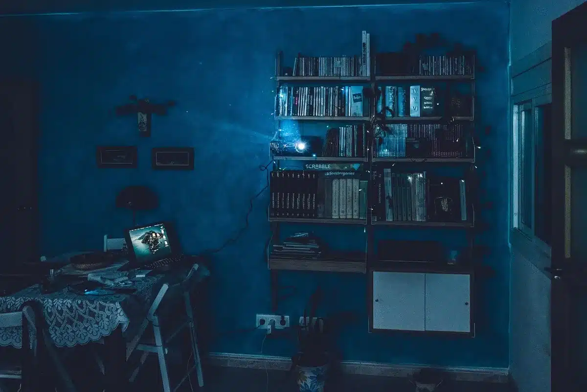 Person editing a short video on a laptop and phone for fast-loading web use