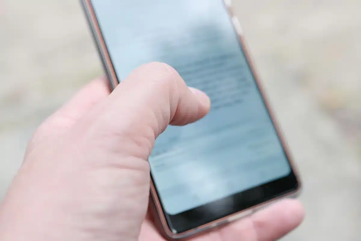 Customer using smartphone to find a nearby shop on a map