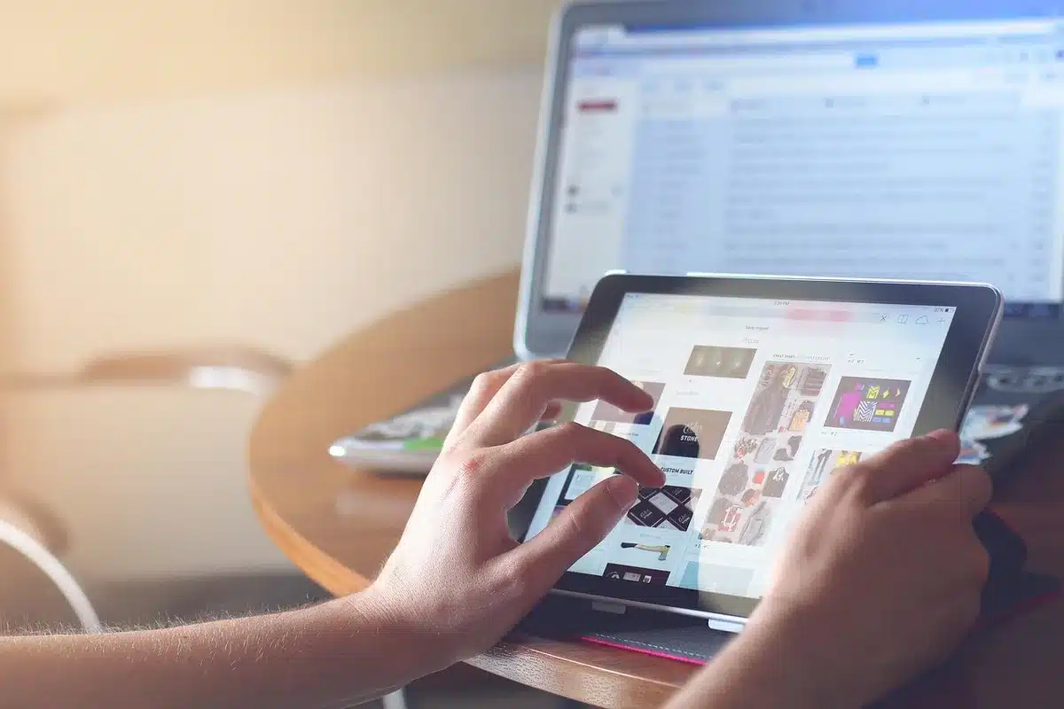 Small business owner reading customer reviews on a tablet
